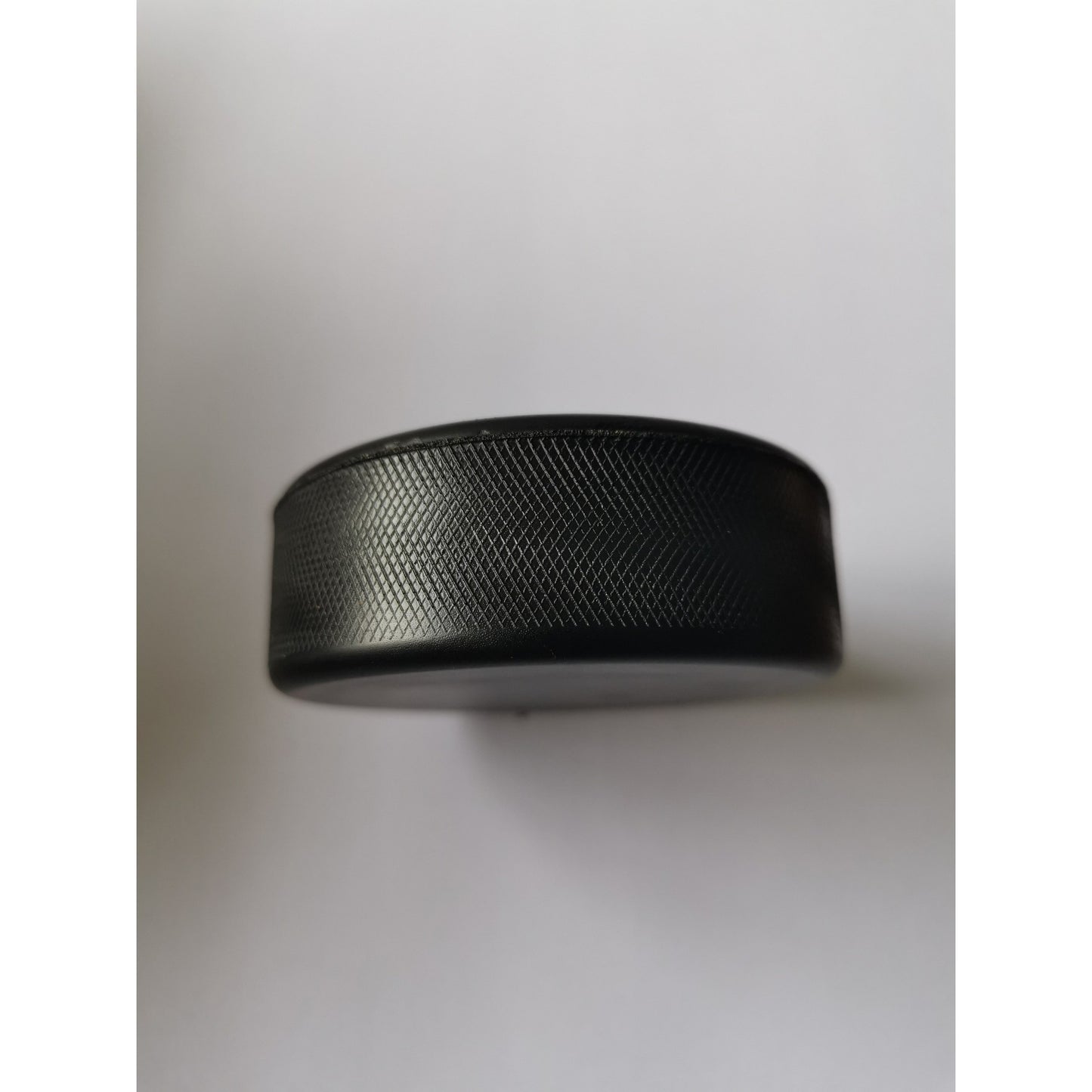 Black Stress Hockey Pucks